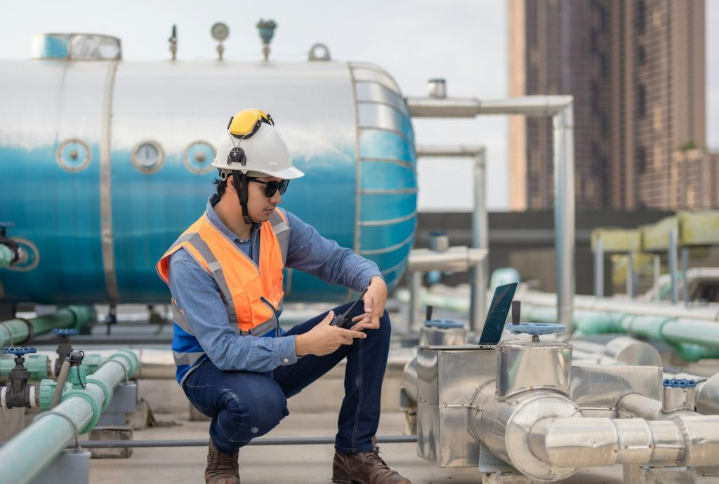 Green HVAC engineer discuss energy efficiency, renewable tech, and CO2 reduction in tower buildings